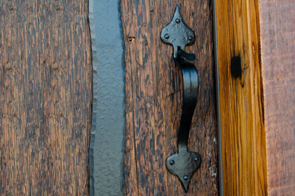 Suffolk thumb latch on a vintage wood door.