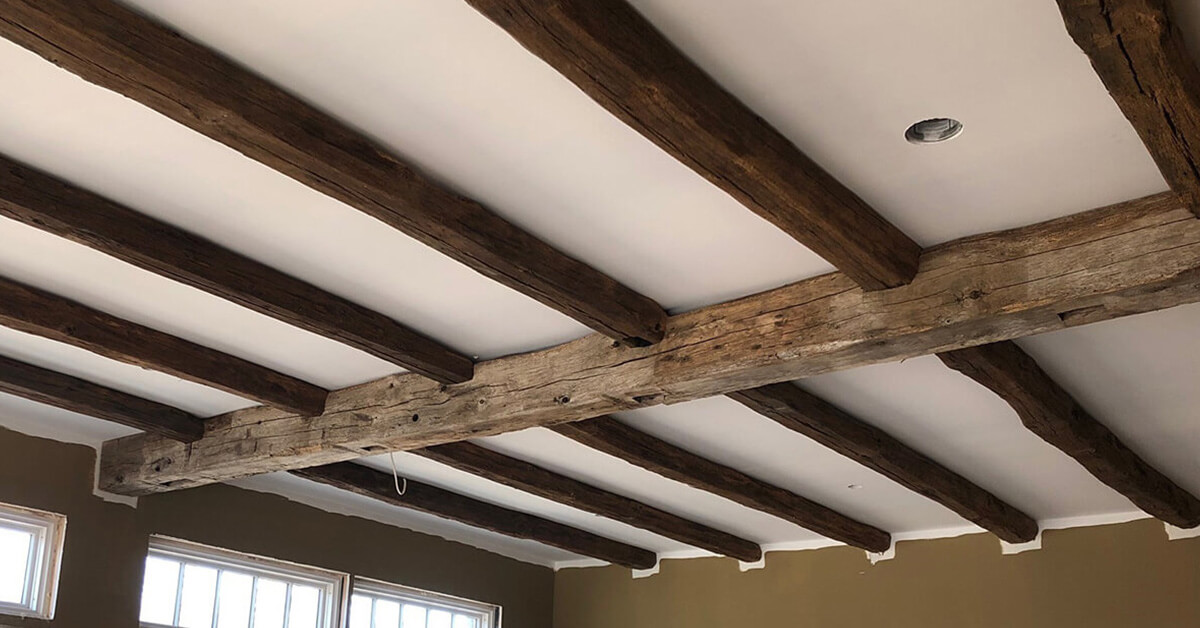 Reclaimed hand-hewn beams on a ceiling