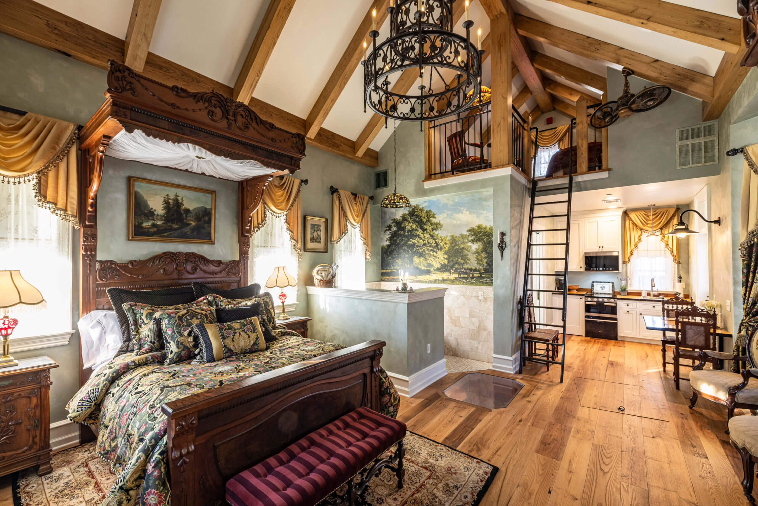Bedroom with reclaimed wood flooring and box beams on the ceiling